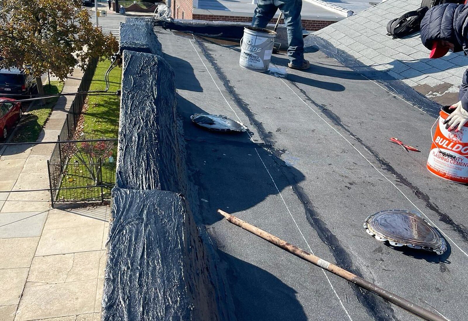 Flat roof waterproofing being applied